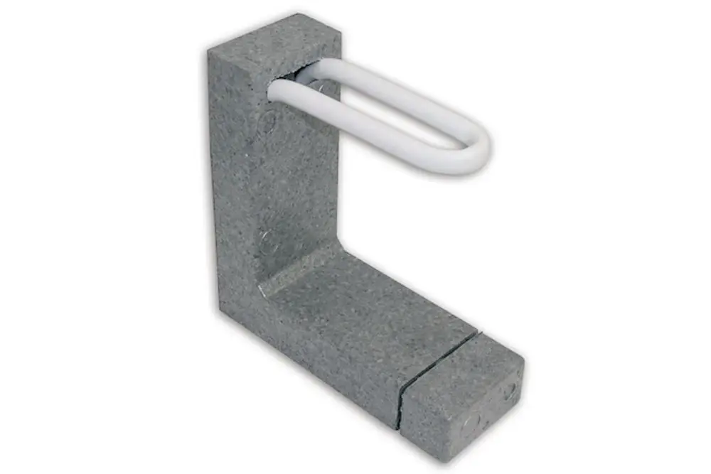 Grauer Anschlussblock mit weißem U-förmigen Element, hergestellt von Roth, dient zur Verbindung von Bauteilen in einer installierten Umgebung.
